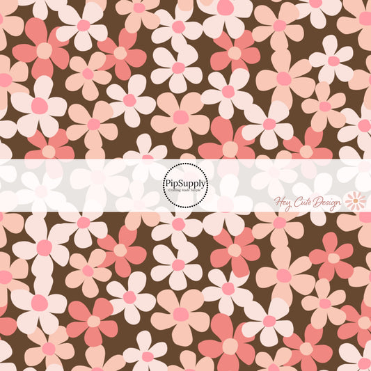 Pink, Peach, and Coral floral print on brown fabric by the yard.