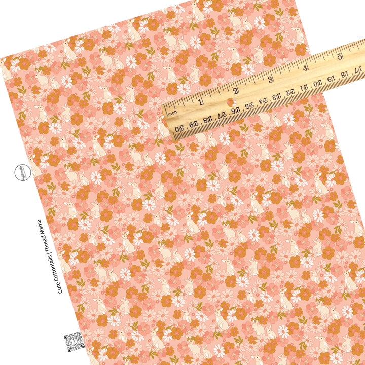 Pink and white flowers and bunny rabbits on a pink faux leather sheet