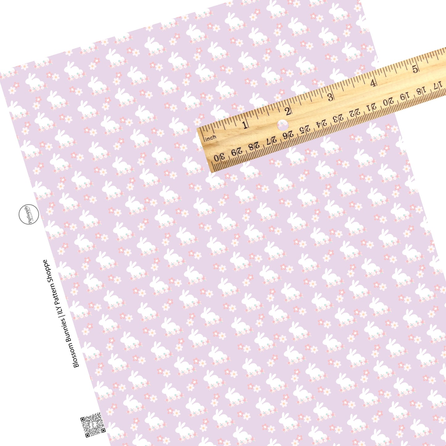 Pink, cream, and blue flowers with white bunnies on lavender faux leather sheets