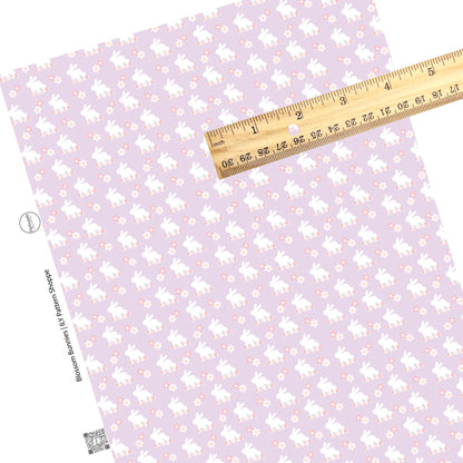 Pink, cream, and blue flowers with white bunnies on lavender faux leather sheets