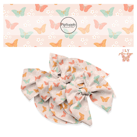 Orange, pink, and aqua butterflies with white flowers on pink bow strips