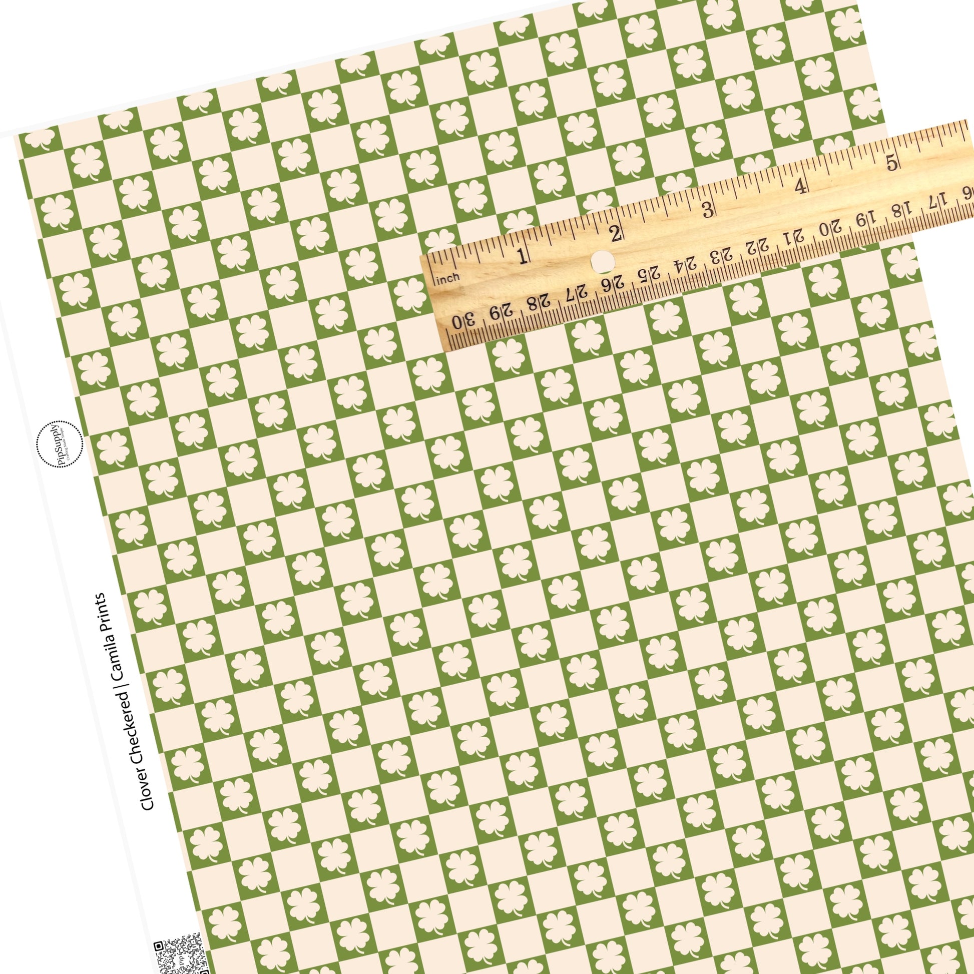 Cream cutout clovers on a green tile with cream checkered faux leather sheet