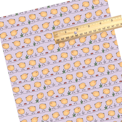 Easter pastel yellow chicks with purple faux leather sheet.