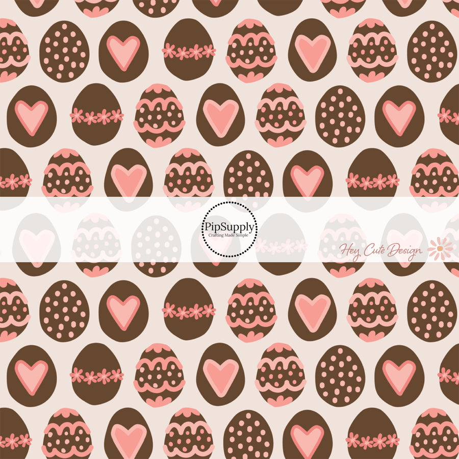 Cream fabric by the yard with chocolate Easter eggs and pink hearts and flowers