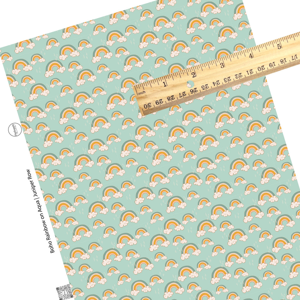 White sparkles on blue and orange rainbows on aqua faux leather sheets