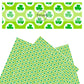 Green shamrocks on white polka dot circles with surrounding polka dots on a green faux leather sheet