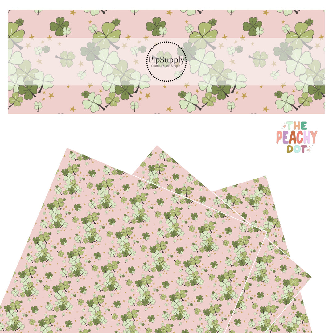 Gold stars and green clovers in clusters on a light pink faux leather sheet