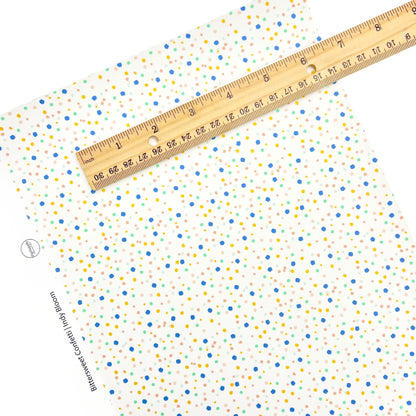 Mini Confetti dots on a cream faux leather sheet.