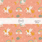 unicorns, rainbows, stars, and flowers on coral fabric by the yard