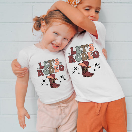 Multi-colored "Let's Rodeo" stars and cowgirl boots iron on heat transfer.