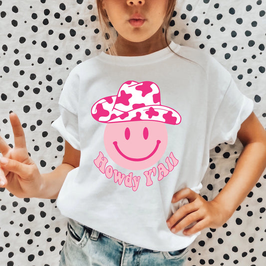 Pink smiley face wearing a pink cowgirl hat and the phrase "Howdy Y'all".