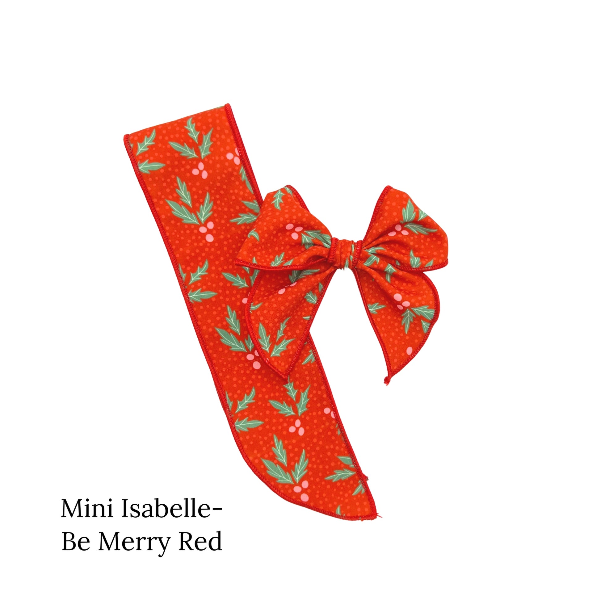 Red christmas bow with red berries and leaves