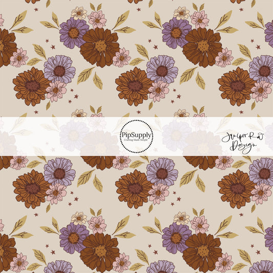 Beige fabric by the yard with pink, burnt orange, and purple floral designs