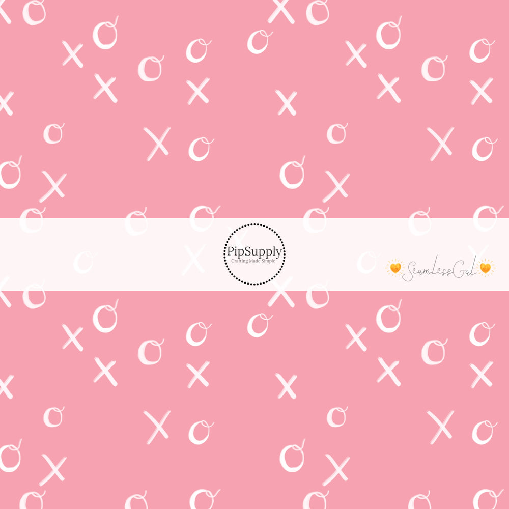 White writing XOXO on pink bow strips