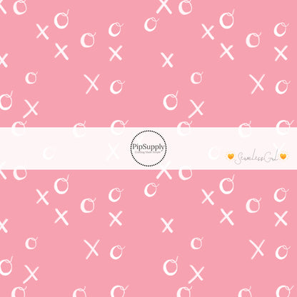 White writing XOXO on pink bow strips