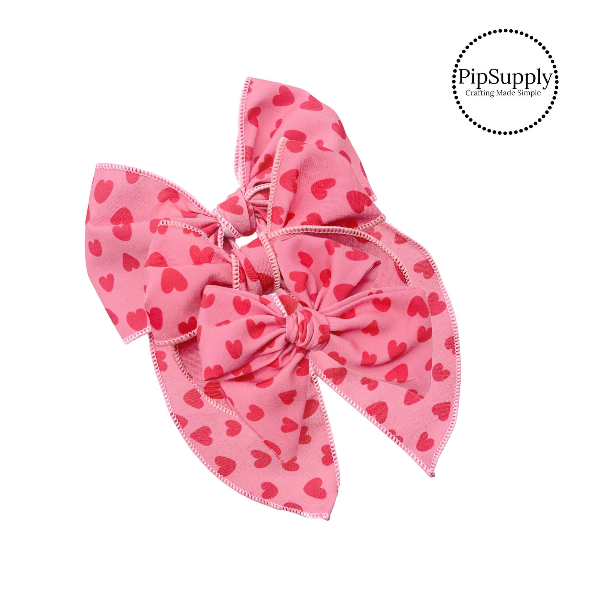 coral pink bow strips with darker pink hearts for valentine's day
