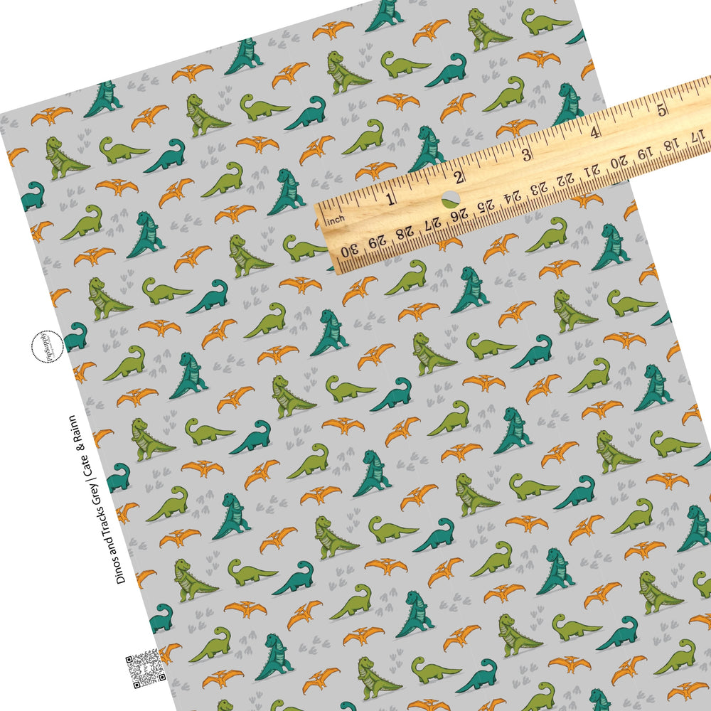 Cute multicolor dino combinations on grey faux leather sheet.