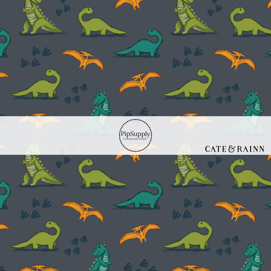 Charcoal gray fabric by the yard with orange, teal, and green dinosaurs