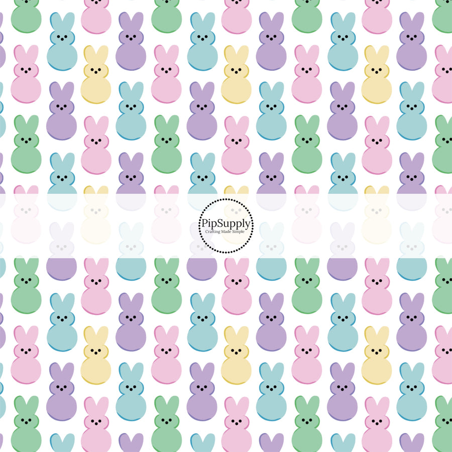 Pastel colored marshmallow bunnies on white fabric by the yard