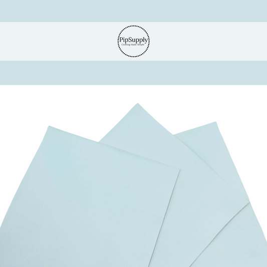 Pale blue smooth solid colored faux leather.