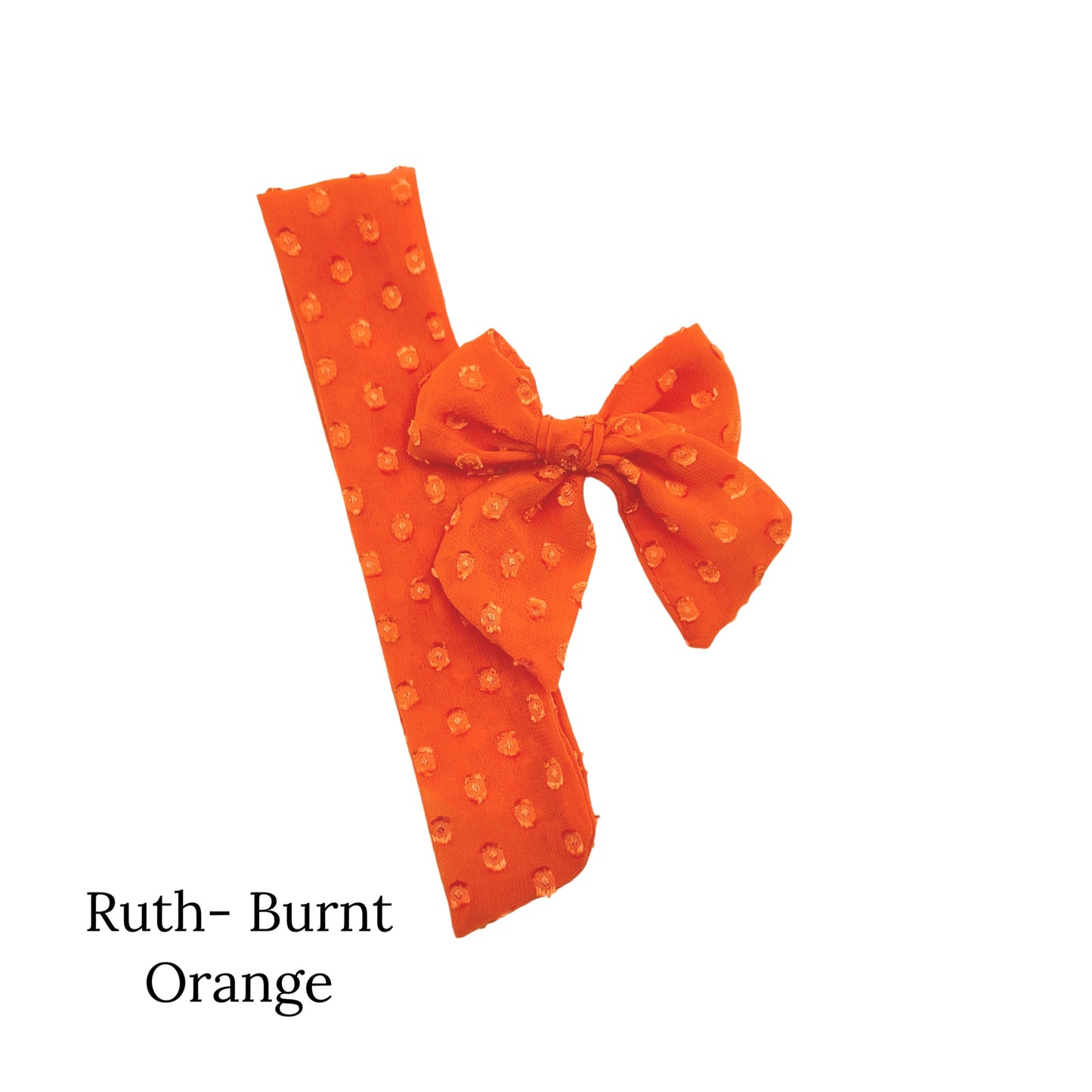 Small Burnt Orange colored bow with frayed dots on a white background