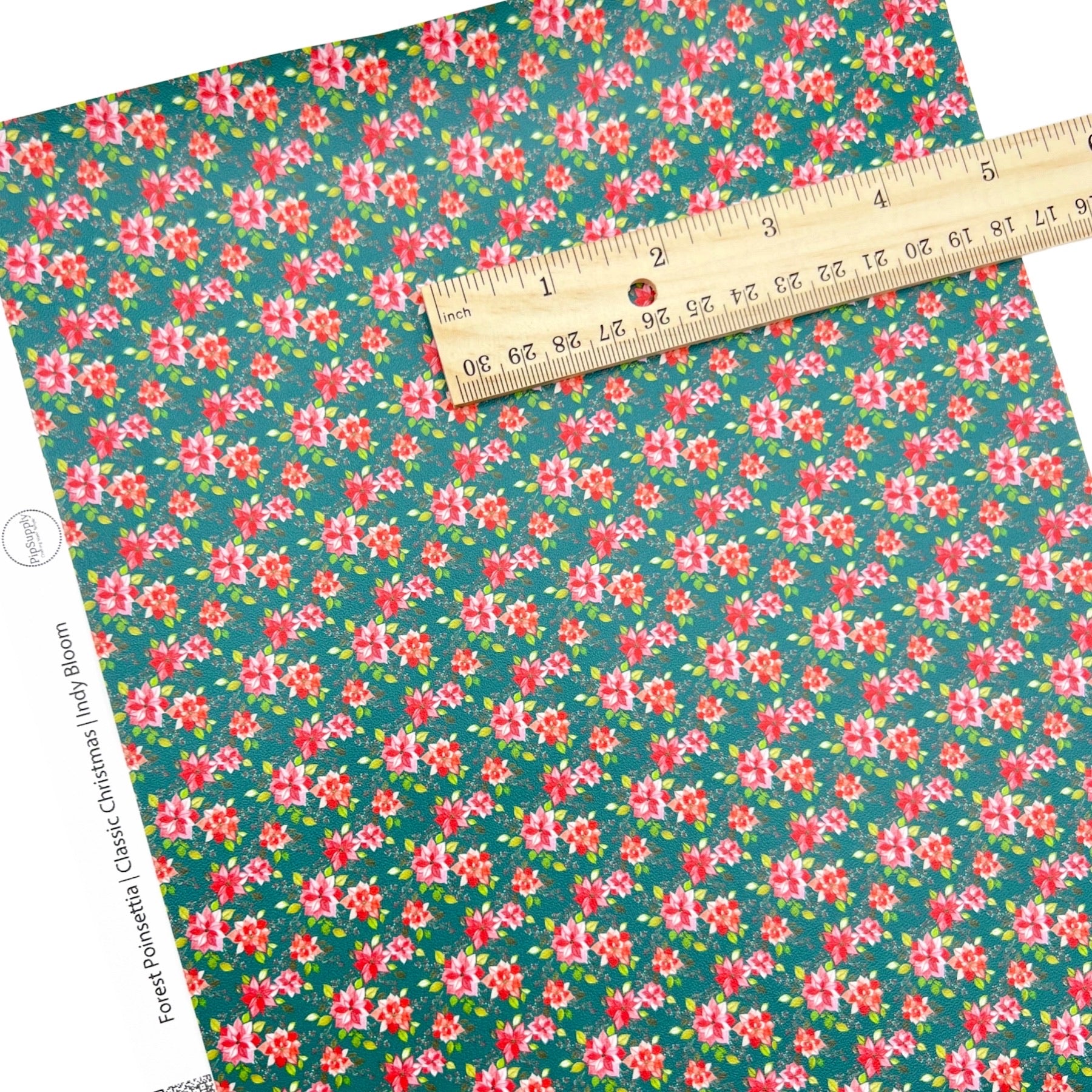 Rolled or individual christmas faux leather sheet with poinsettias on green