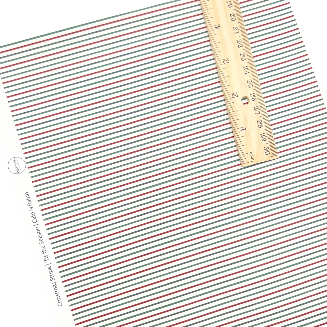 Rolled or individual christmas faux leather sheet with red, green, and blue stripes on a white background