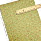 Green Faux leather sheet with neutral colored dots
