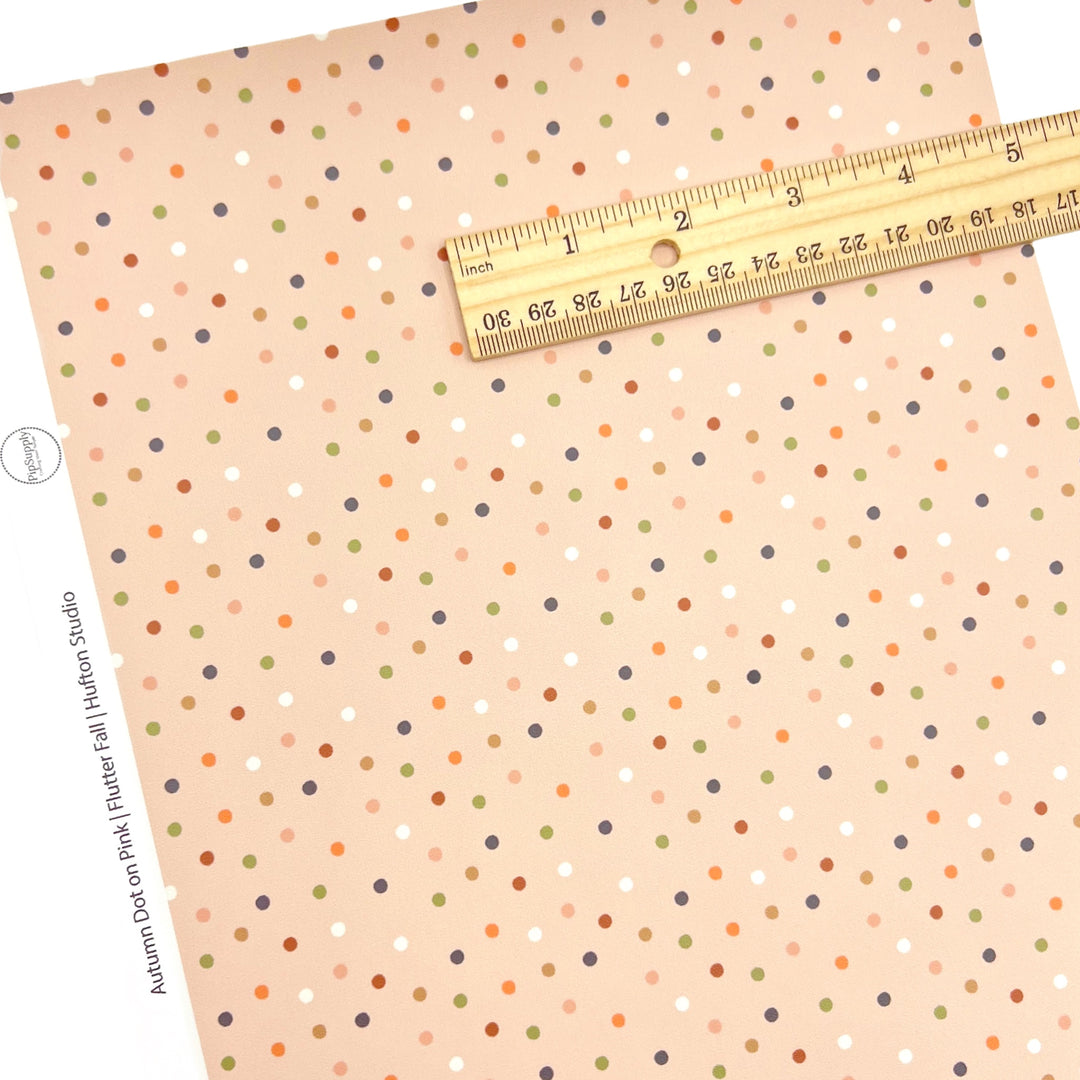 Light pink colored faux leather sheet with neutral colored dots