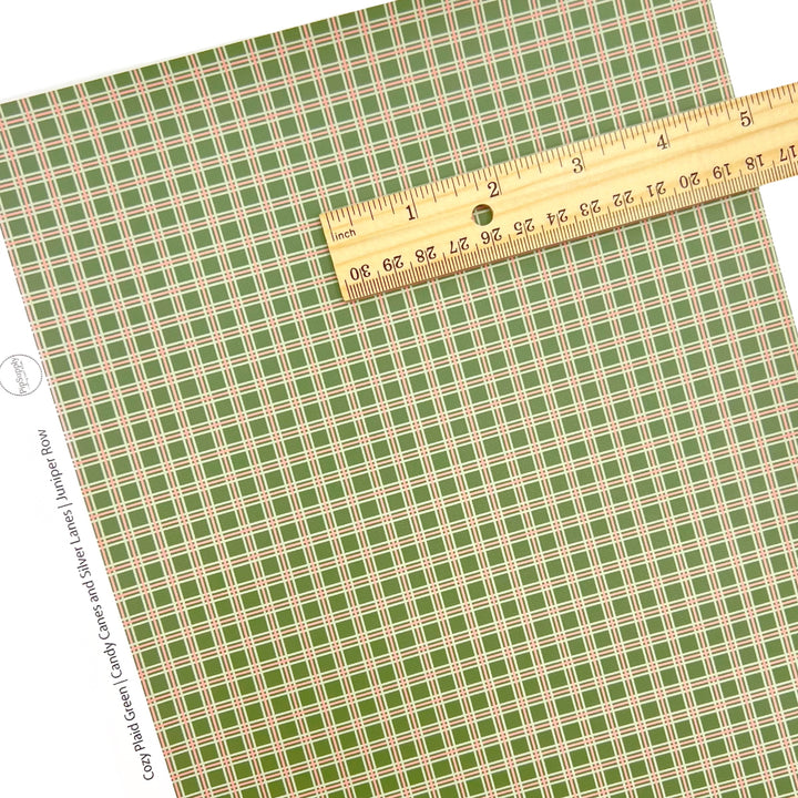 Individual holiday christmas green plaid faux leather sheet with a ruler lying on top