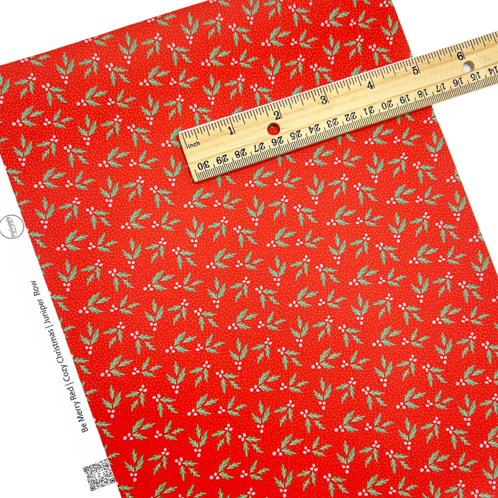 Red faux leather sheet with pines and berries