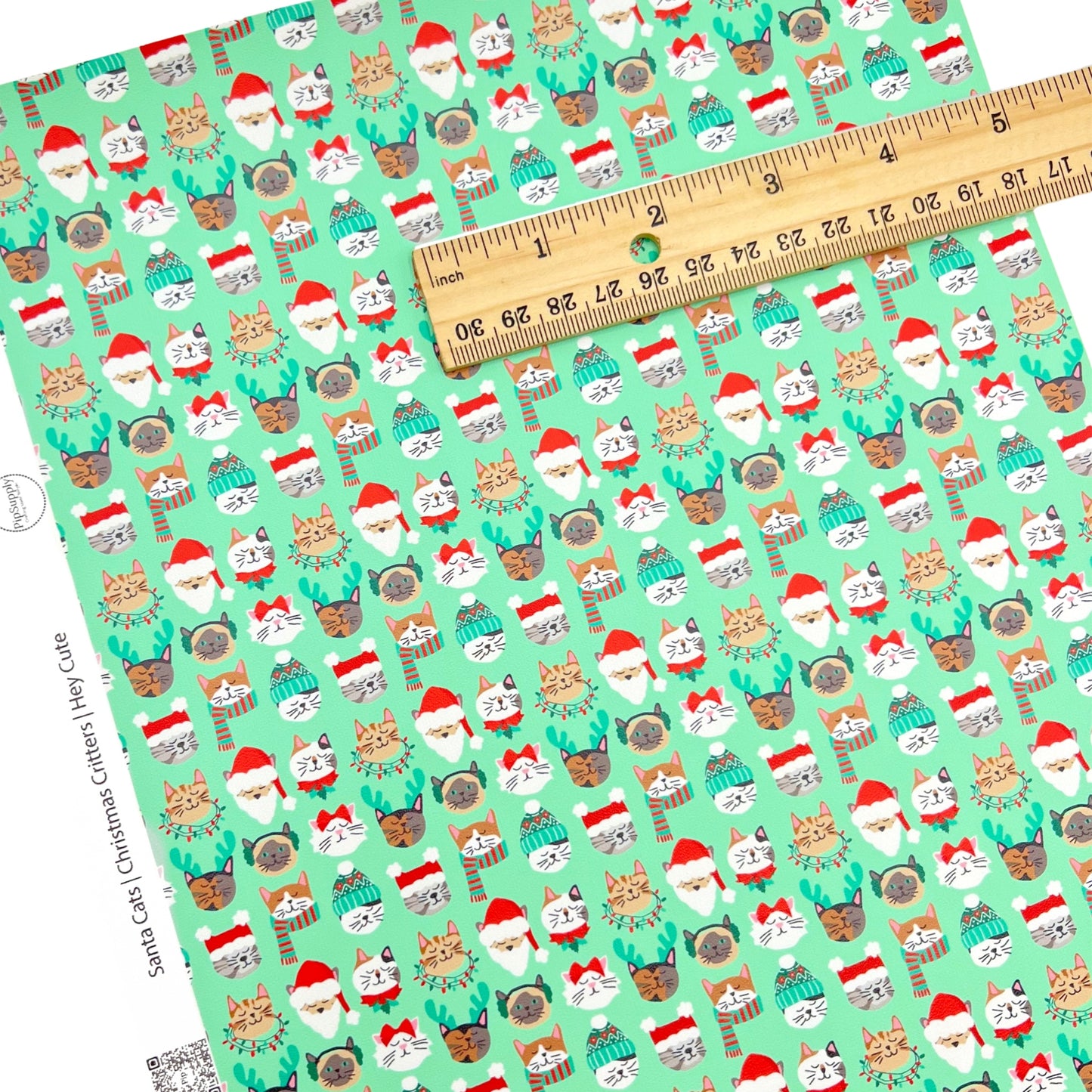 Green individual faux leather sheet with cats wearing a santa hat 