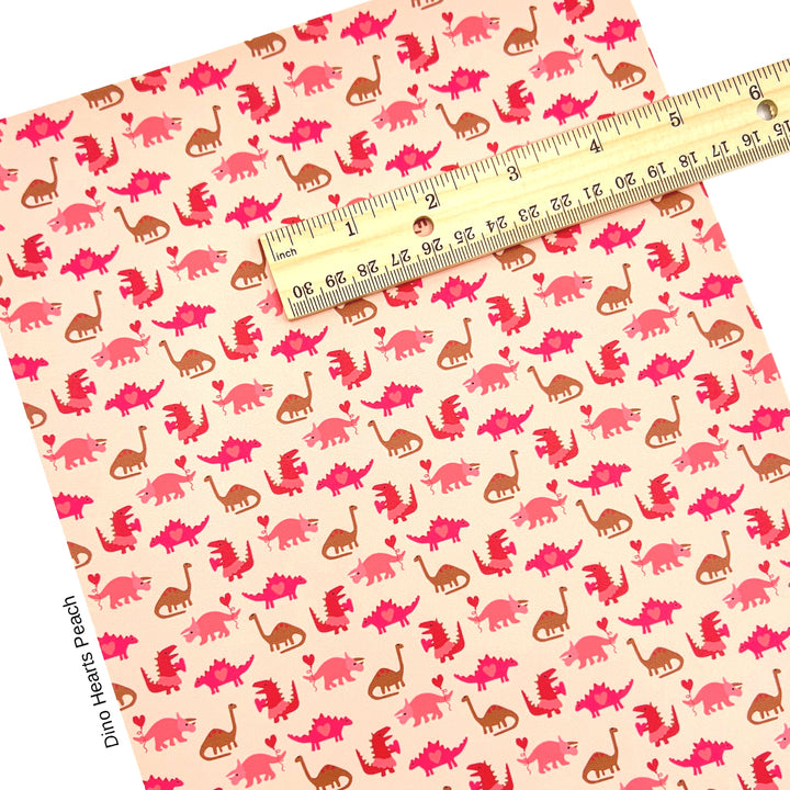 Valentine Faux leather sheet with pink dinosaurs on a tan background