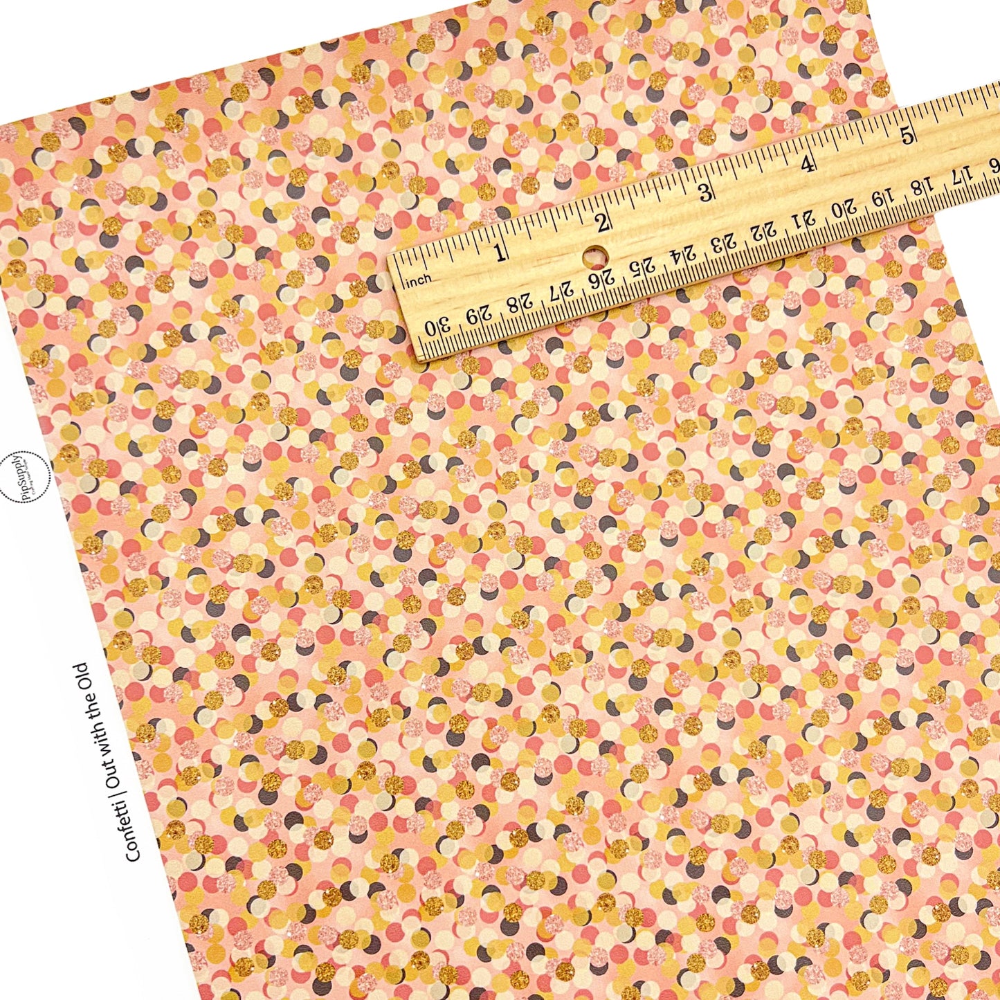 peachcolored faux leather sheet with confetti designs
