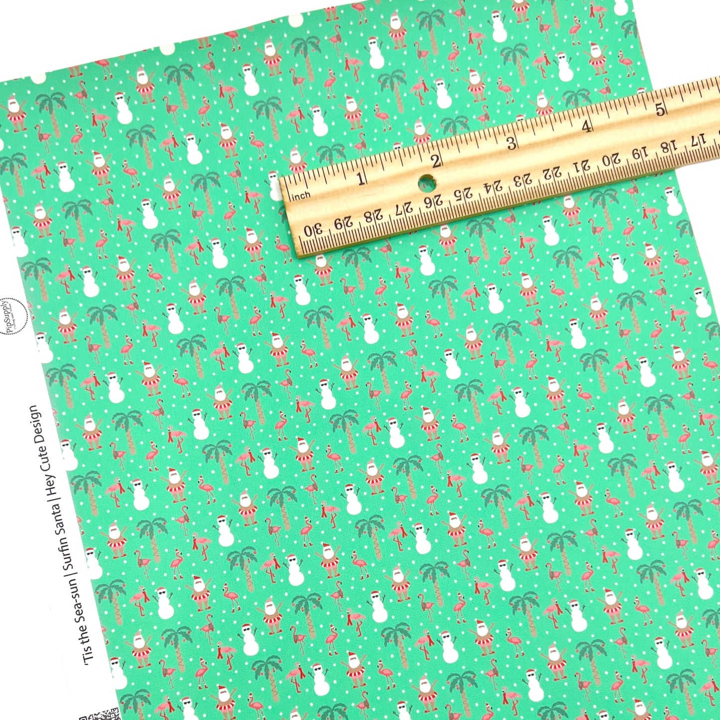 Green christmas faux leather sheet with santa on vacation