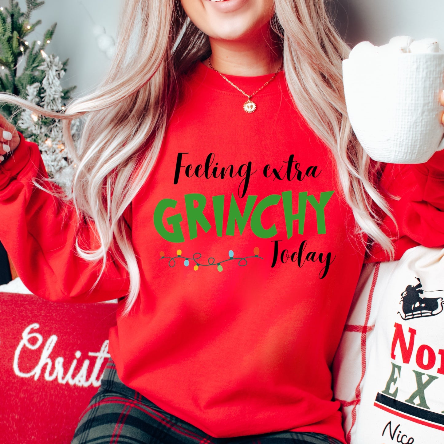 Christmas character Iron On Transfer with the words "Feeling extra Grinchy" on a red sweatshirt. Christmas Heat Transfers.