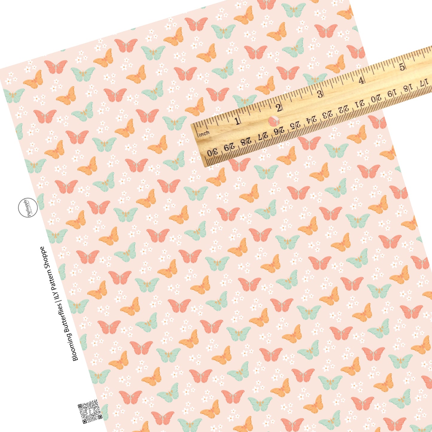White daisies with pink, orange, and aqua butterflies on light pink faux leather sheet