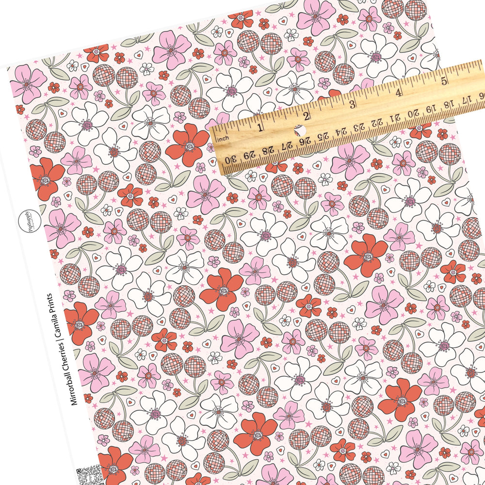 Flowers with pink stars and disco cherries on white faux leather sheets