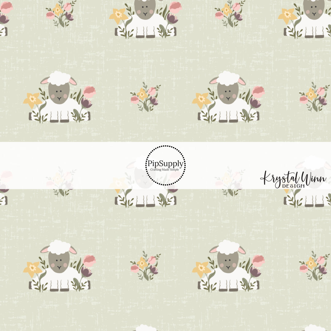 Yellow, pink, and purple flowers with white sheep with a gray face and blushing cheeks on a green distressed bow strip