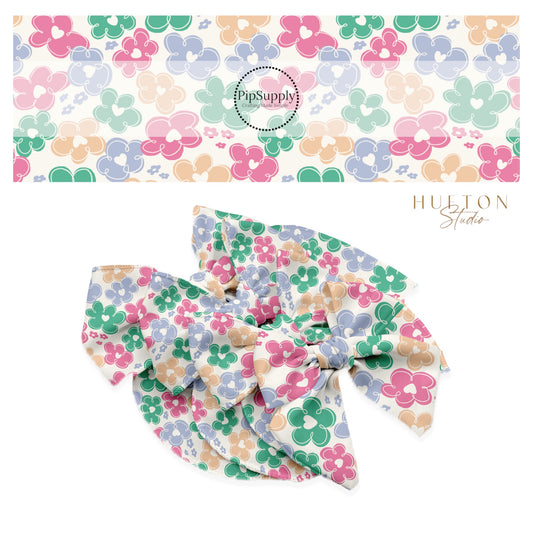 Cream hearts on blue, pink, and green flowers on a cream bow strip