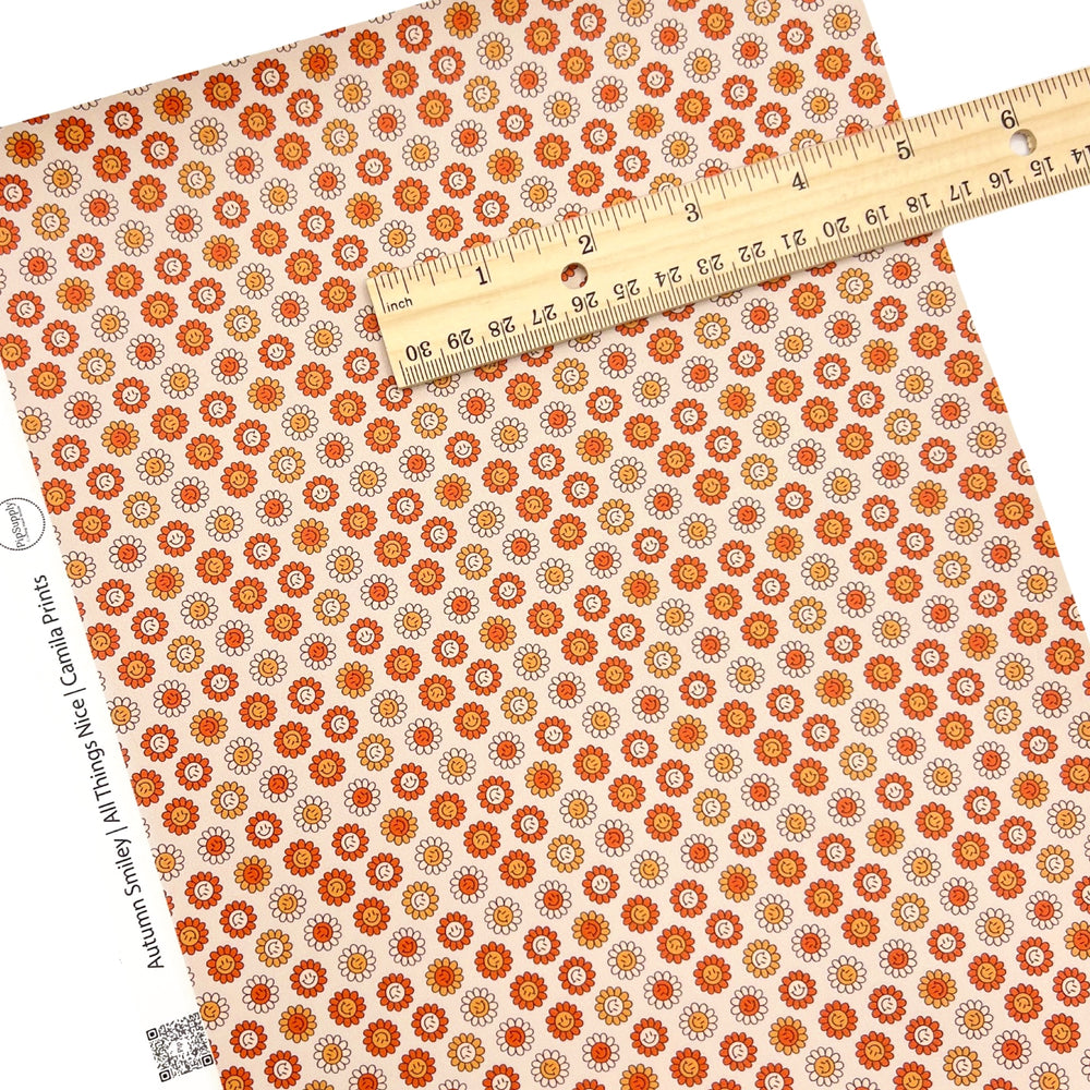 orange yellow smiley face faux leather sheet on light orange background