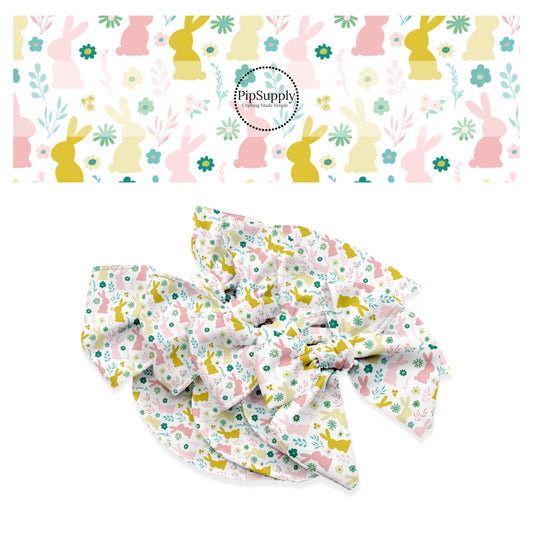 Pink and golden bunnies with pink and green flowers and weeds on white bow strips
