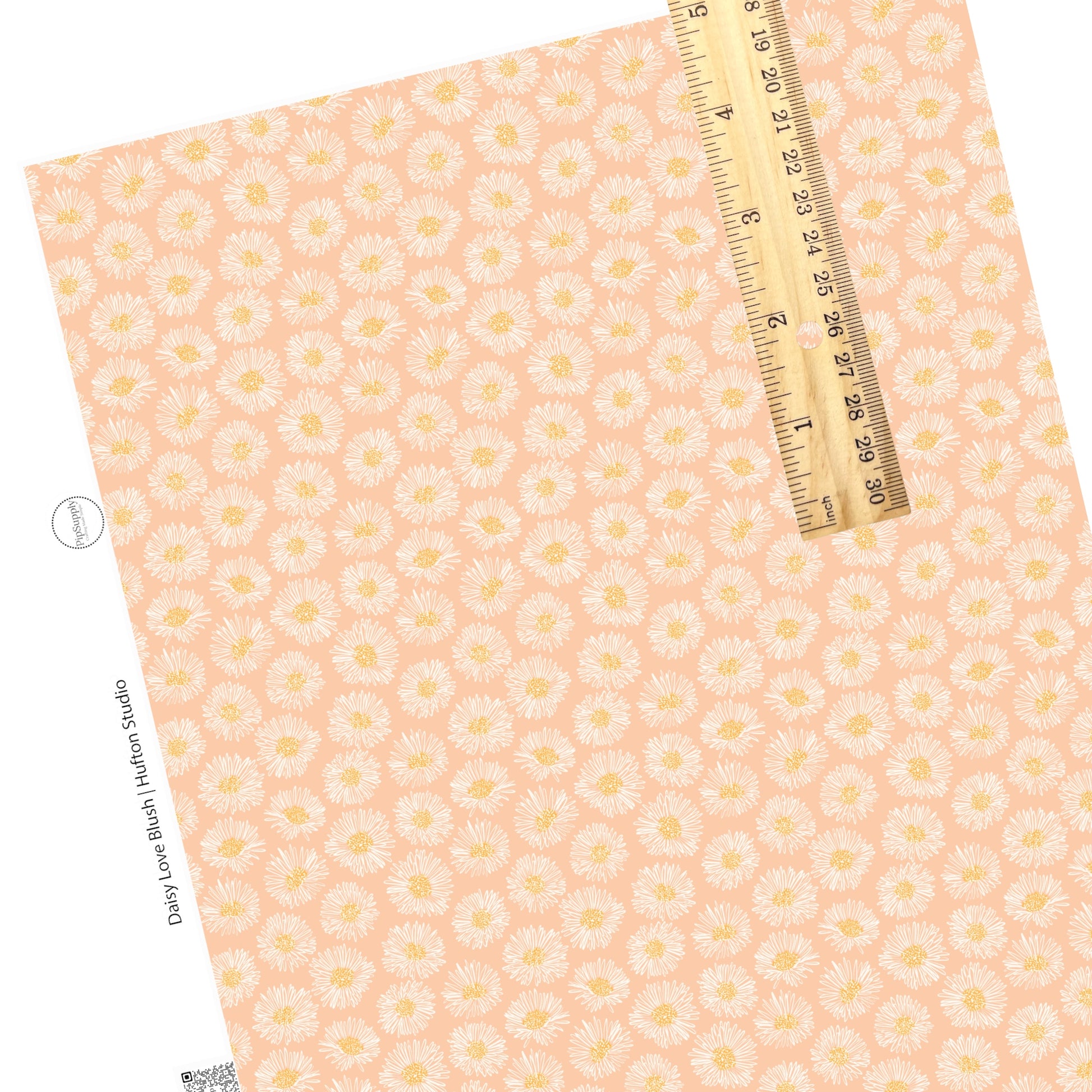 White blooming daisies with yellow center on blush faux leather sheet