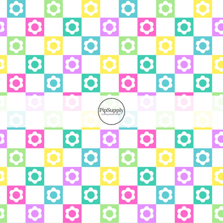 White flower cutouts on green, purple, pink, and yellow checkered bow strips