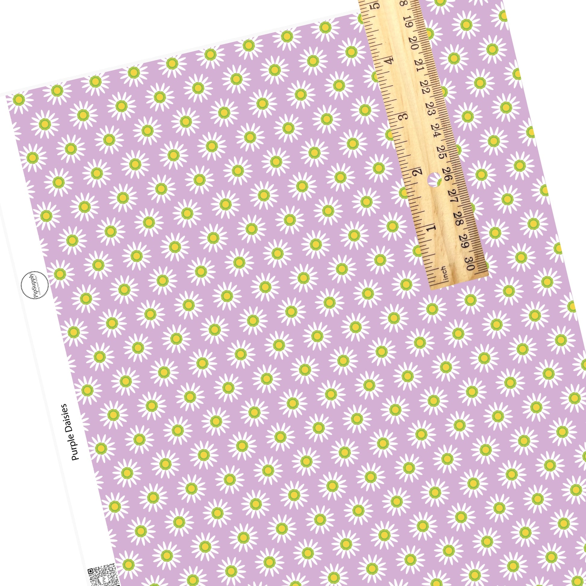 White flowers with yellow center on purple faux leather sheets