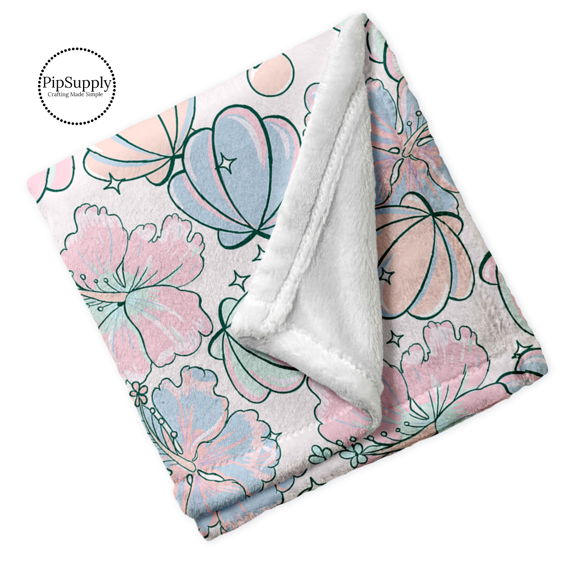 Soft white folded blanket with top print of pastel pink, blue, and orange sea shells and hibiscus floral.