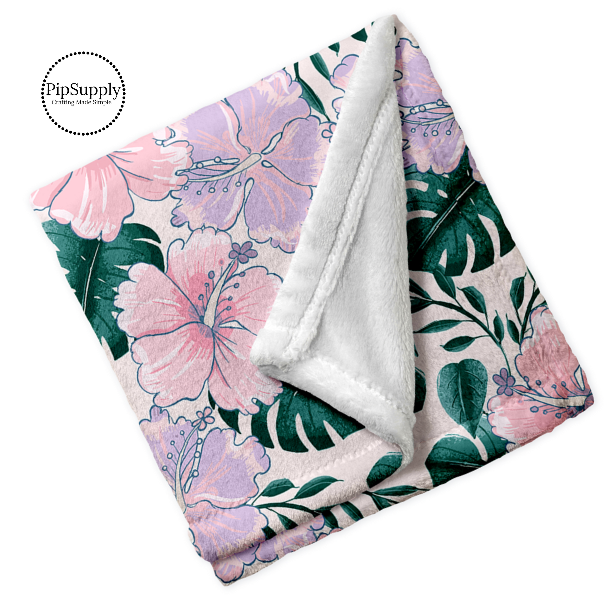 Folded soft white blanket with light pink and lavender hibiscus floral with tropical green leaves pattern.