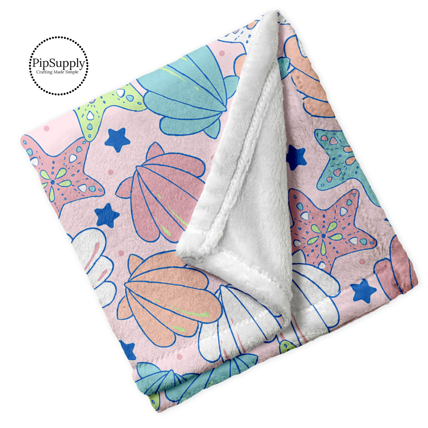 Soft folded white blanket with top print of aqua, pink, tangerine, and green seashells and starfish on light pink.