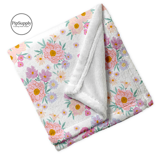 Folded customizable white minky blanket with pink floral bouquet pattern.
