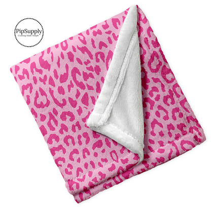 Soft folded minky blanket with hot pink and light pink leopard animal print.